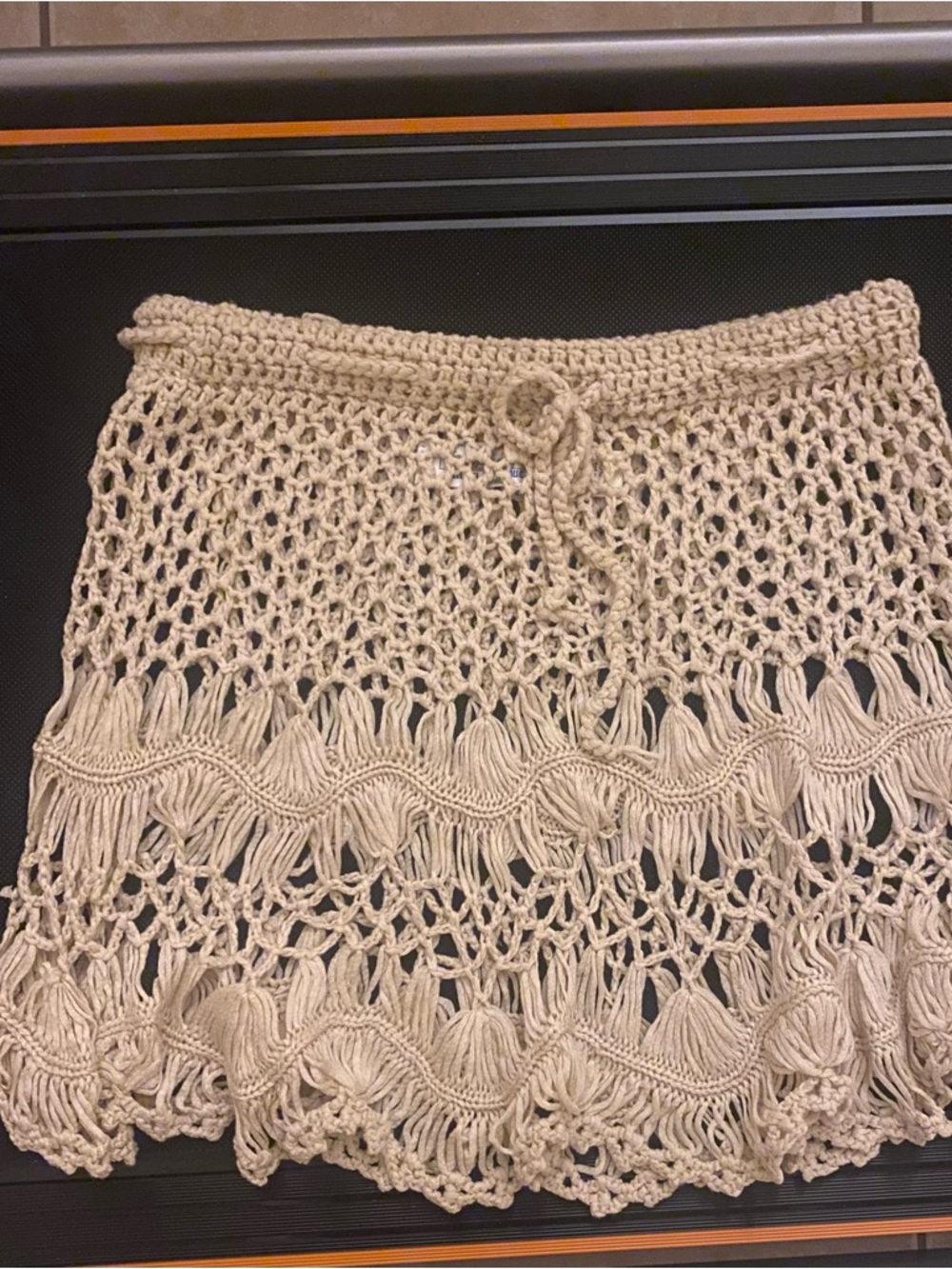 SOFT, TAN/BEIGE BEACH BATHING SUIT COVER SKIRT. I’M A MEDIUM AND IT FITS GREAT.